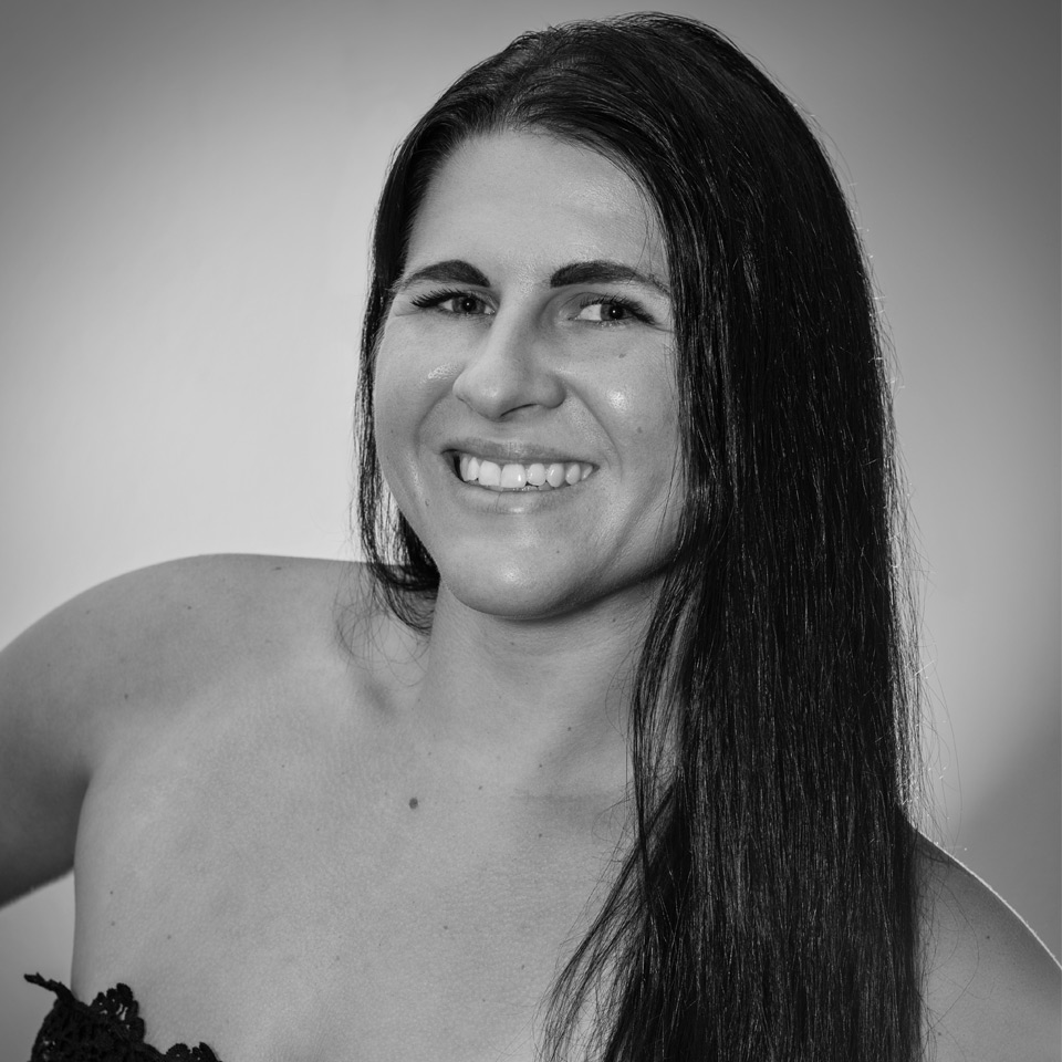 smiling female real estate photographer headshot black and white