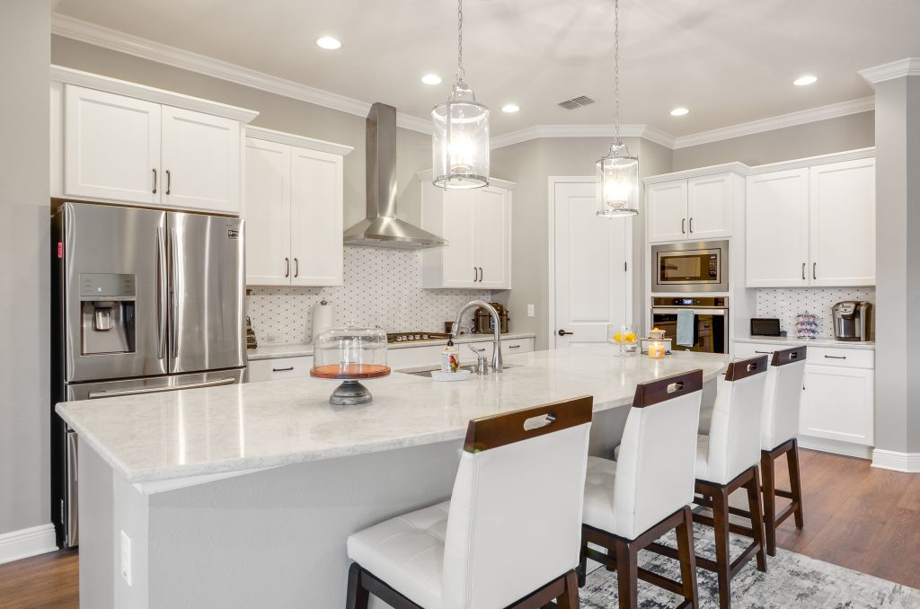 photo of a kitchen with white cabinets and countertops