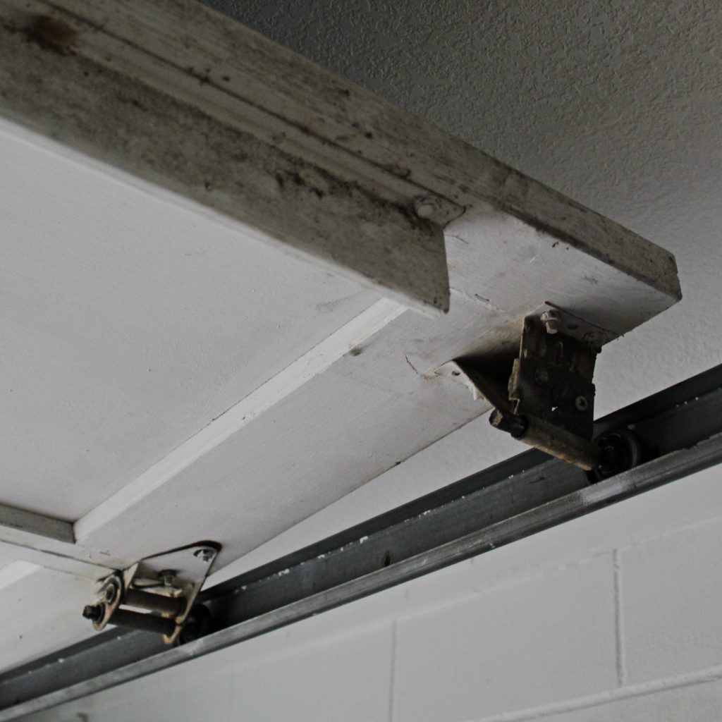 old and broken garage door hardware photo