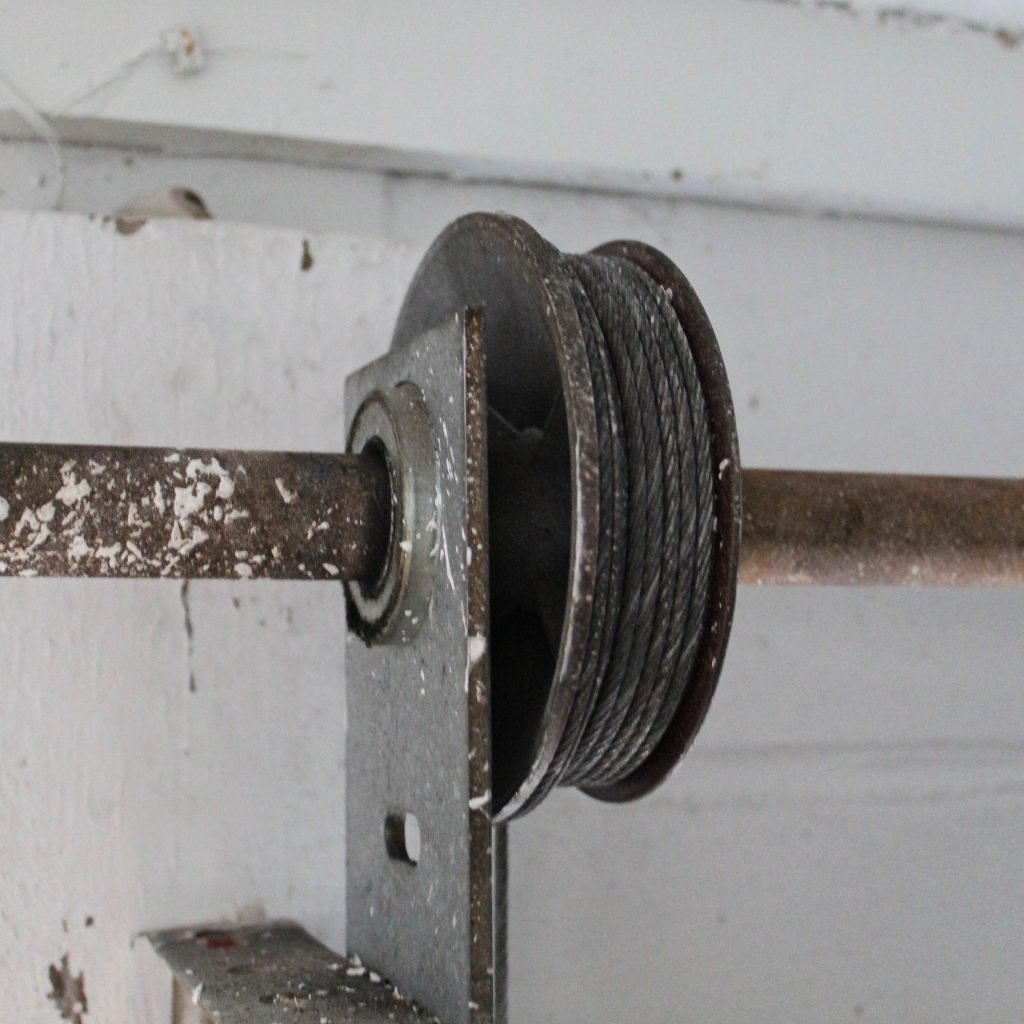 old and worn garage door hardware photo