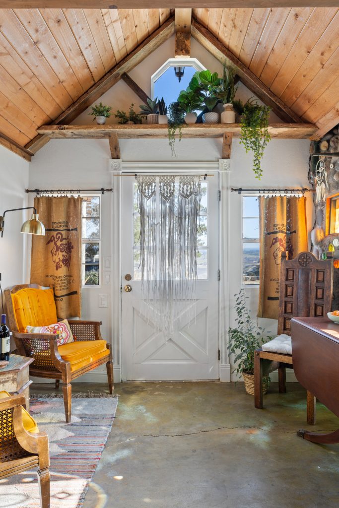 eclectic bohemian air b&b listing with succulents and found decorations