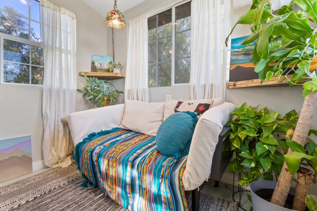 eclectic bohemian air b&b listing sofa and plant photo