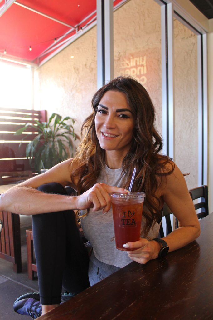 attractive smiling multiracial woman with tea headshot