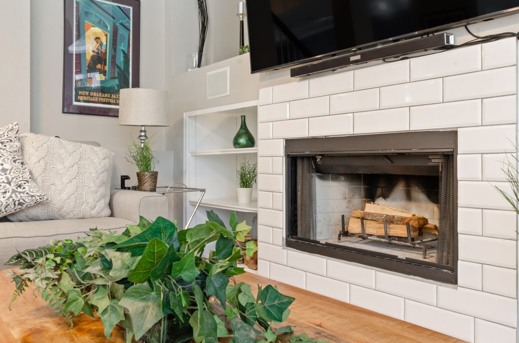detail editorial photograph of a fireplace in a cozy living room