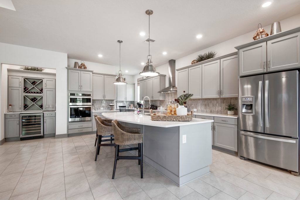 staged kitchen with wine cooler and dry bar photo