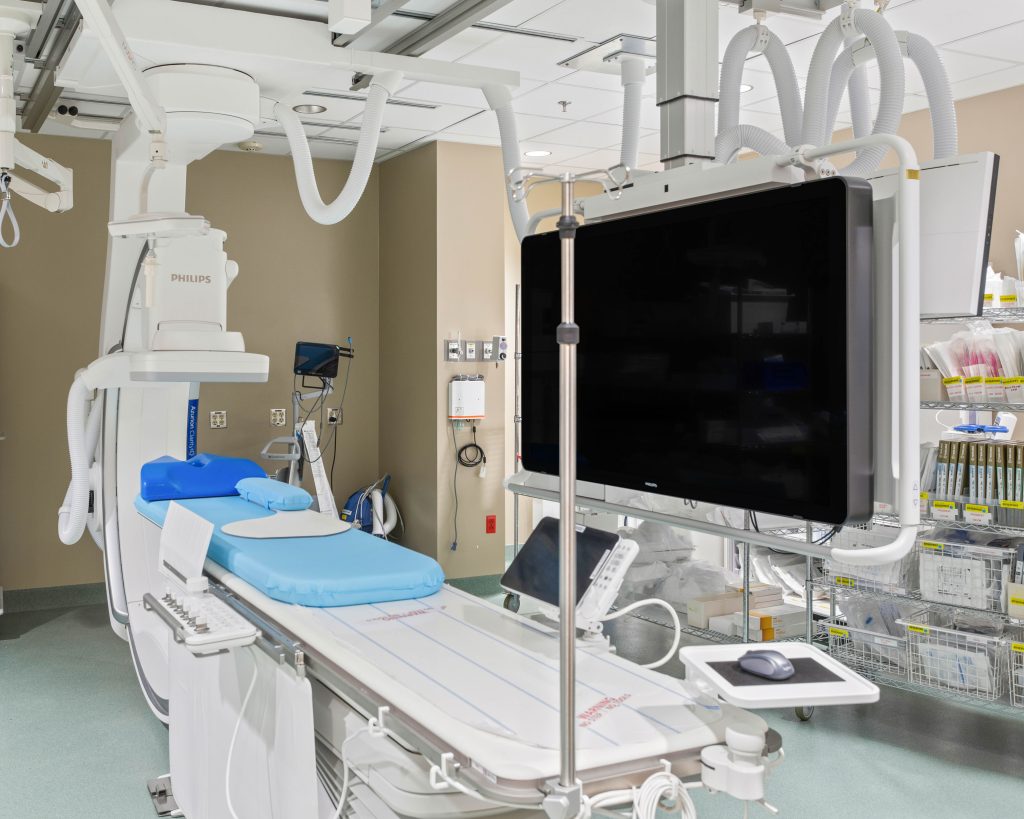 close up photo of blue cord MRI machine in a hospital