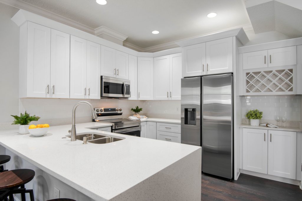 photo of a white cabinetry kitchen with home staging