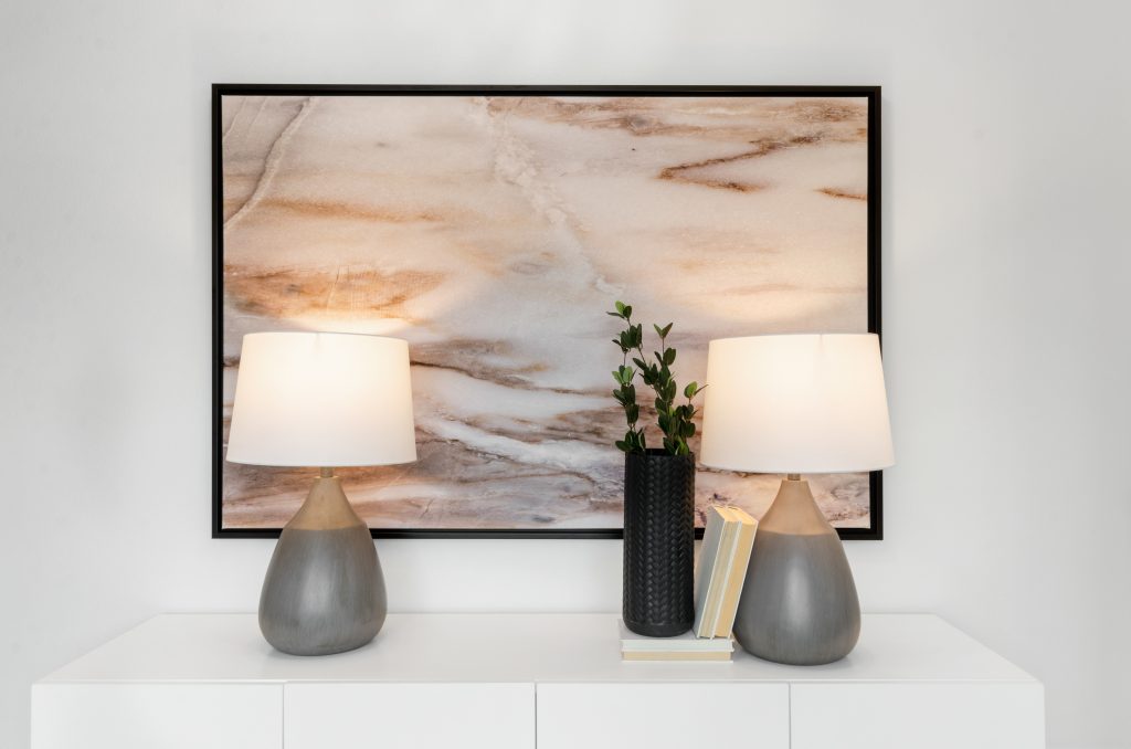 home staging photograph of art, lamps, and plant